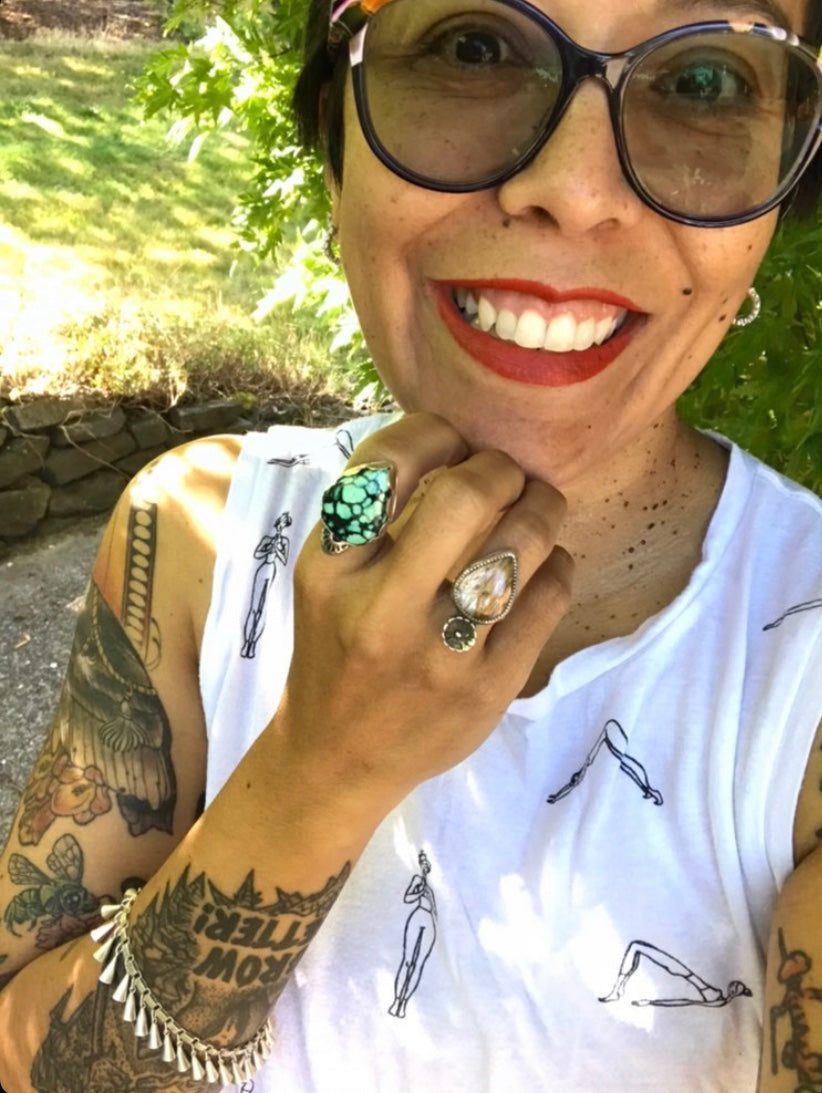 Pretty Latina Latinx woman bought herself the gift of handmade rings. Stands in the sun with red lipstick. She can get herself & loved one's gifts to match. Matching jewelry sets. Rings can be made to order & custom made.