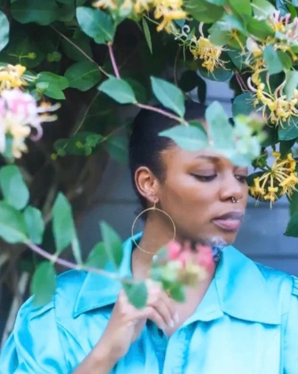 beautiful Black woman in handmade hoops standing behind the honeysuckle. earrings are the perfect gift for any woman or person with pierced ears. Great holiday gift ideas. Can be matched with other jewelry for gift baskets.